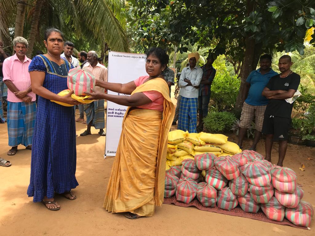 DISTRIBUTION OF DRY FOOD PACKETS TO FISHERMEN